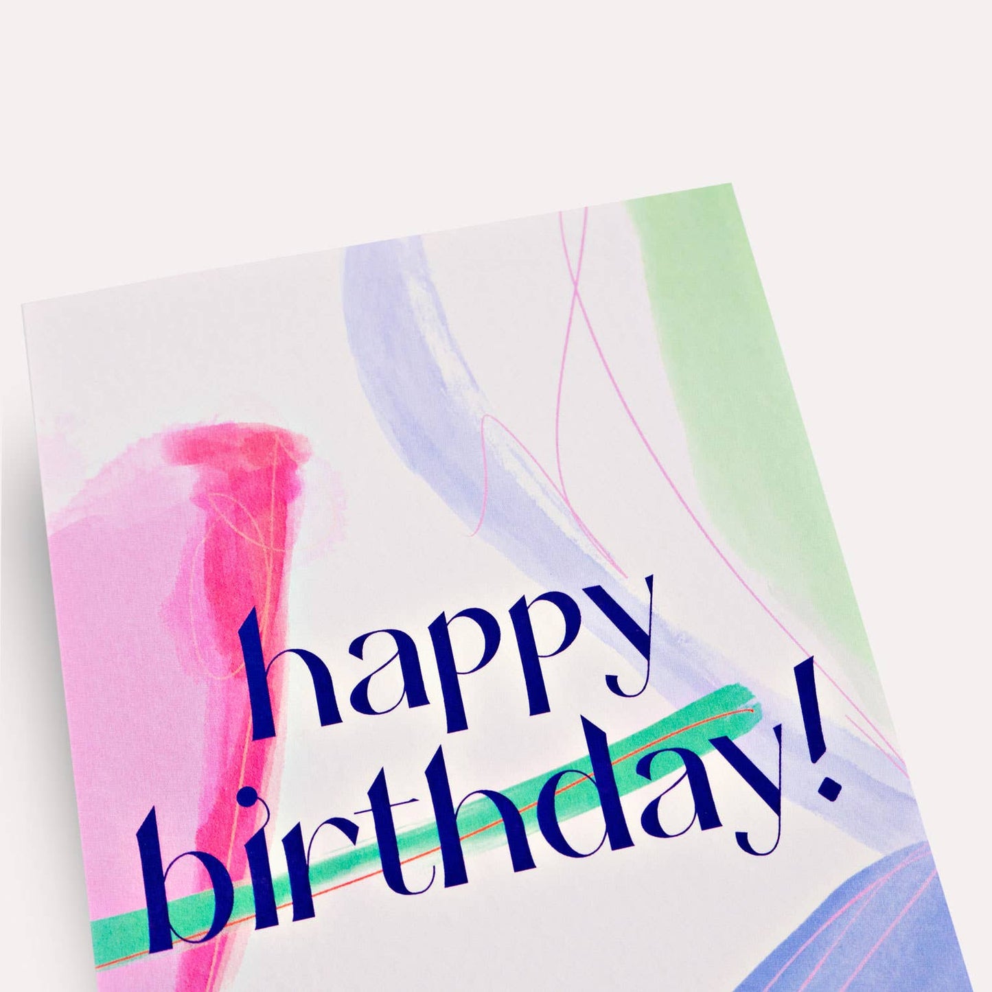 Greeting card with 'happy birthday!' text on a colorful abstract background