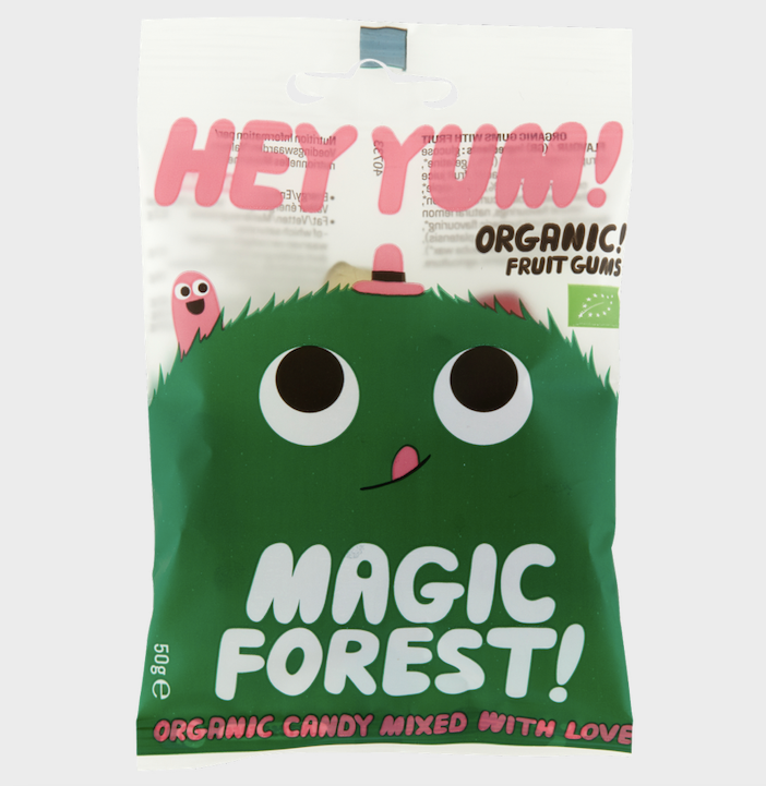 Packaging of HEY YUM! Magic Forest organic fruit gums featuring a cartoonish green character and text against a white background.