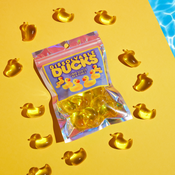 Pack of Dissolvale Ducks on a yellow background with water texture