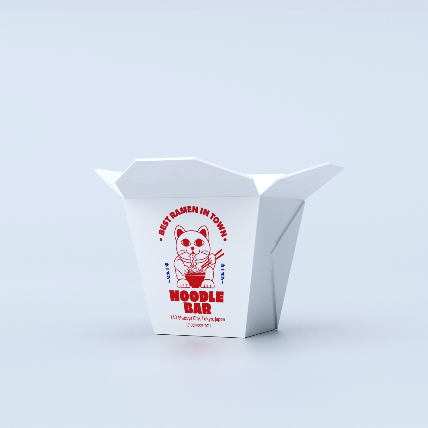 A white rectangular takeout box with red and blue graphics featuring a lucky cat and 'Noodle Bar' text, and a 'Best Ramen in Town' stamp.