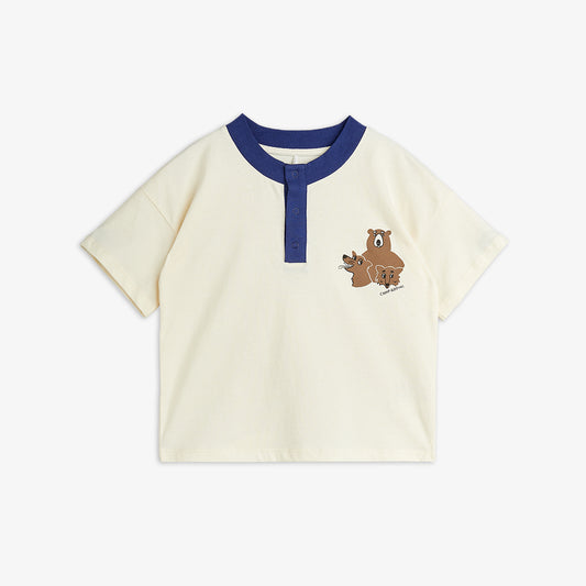 Beige t-shirt with blue collar and bear embroidery on a white background