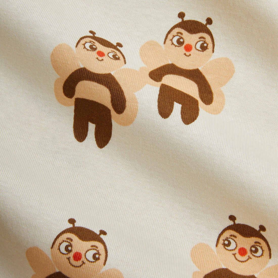 Pattern of cartoon bee characters on a beige background