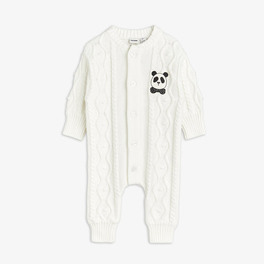 White cable knit baby romper with panda design on a white background