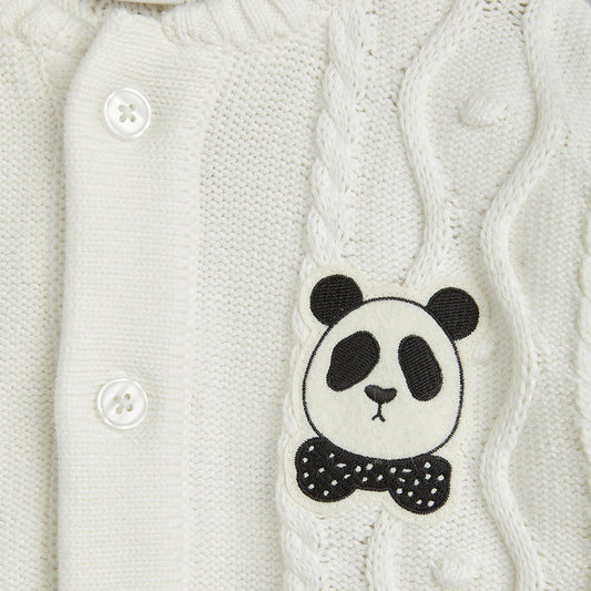 White cable knit sweater with a panda patch featuring a bow tie.