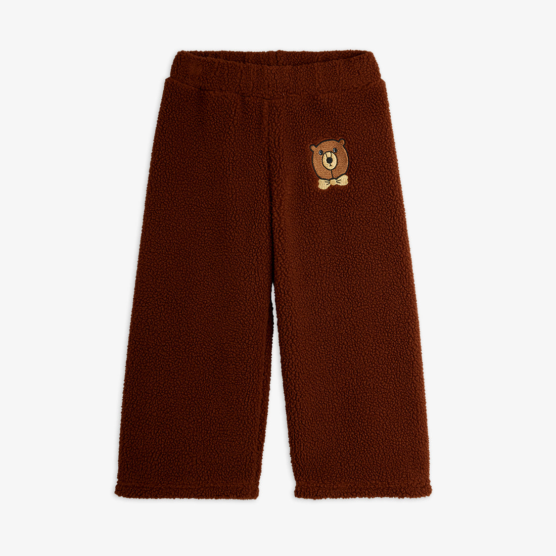 Brown fleece pants with a bear patch on a white background