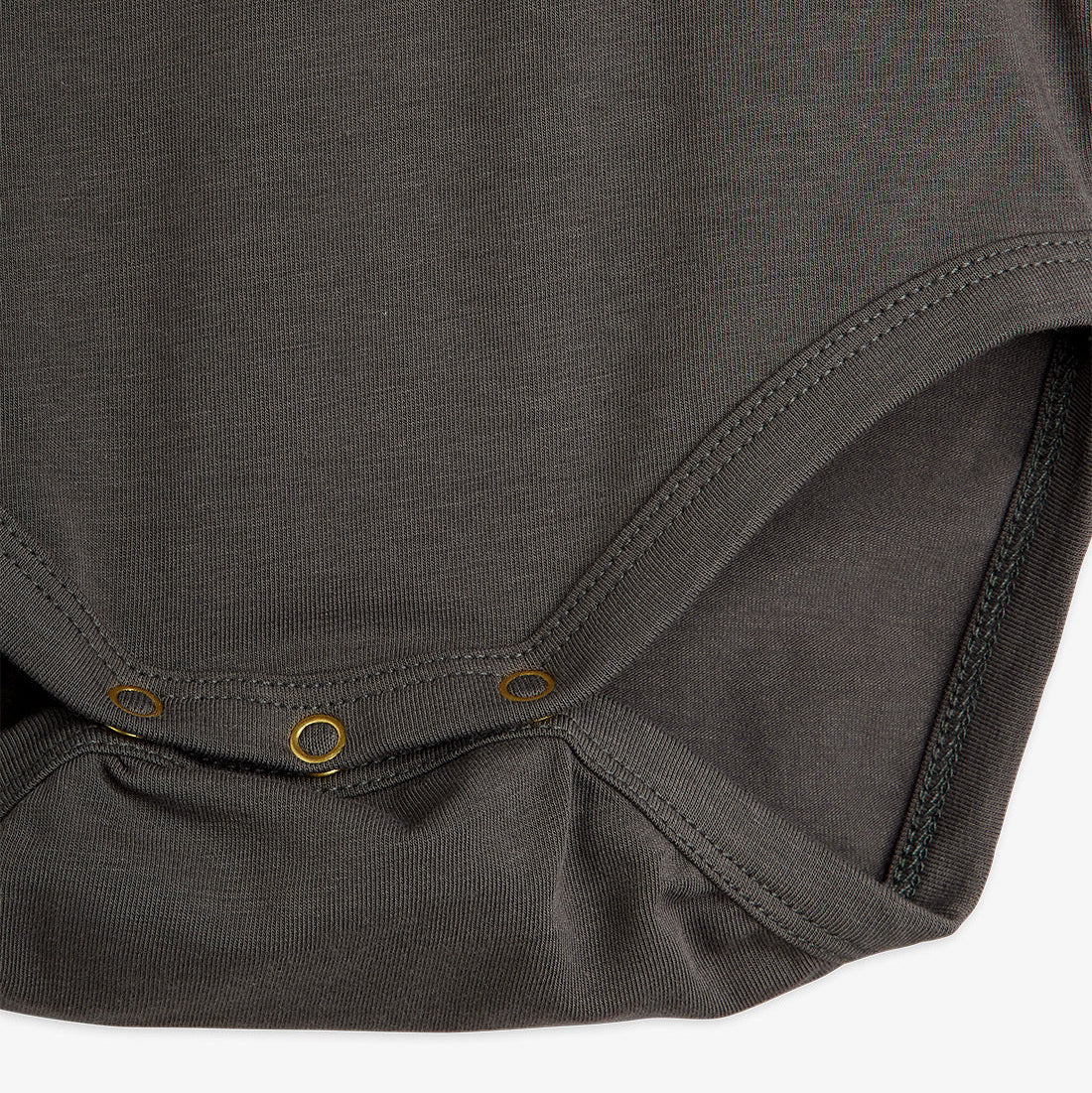 Close-up of a dark gray baby bodysuit on a white background