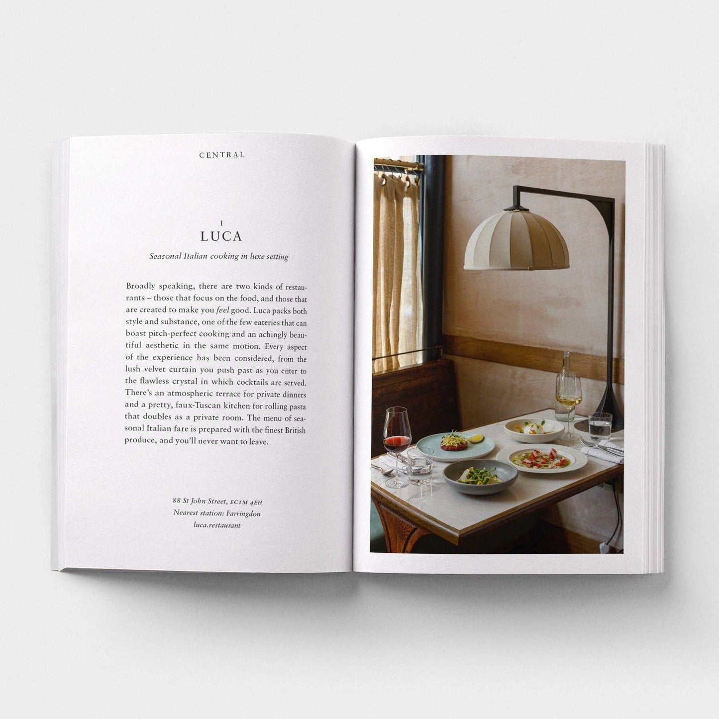 Open book with text on one page and a restaurant interior on the other