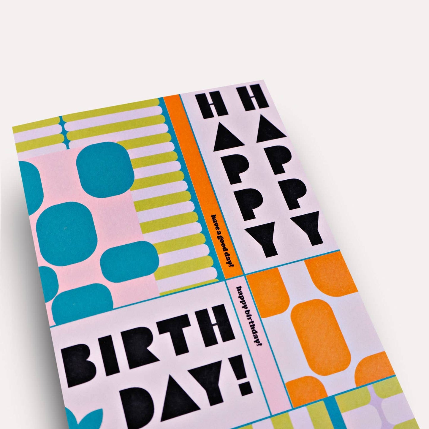 Colorful birthday card with geometric patterns and 'Happy Birthday!' text on a white background