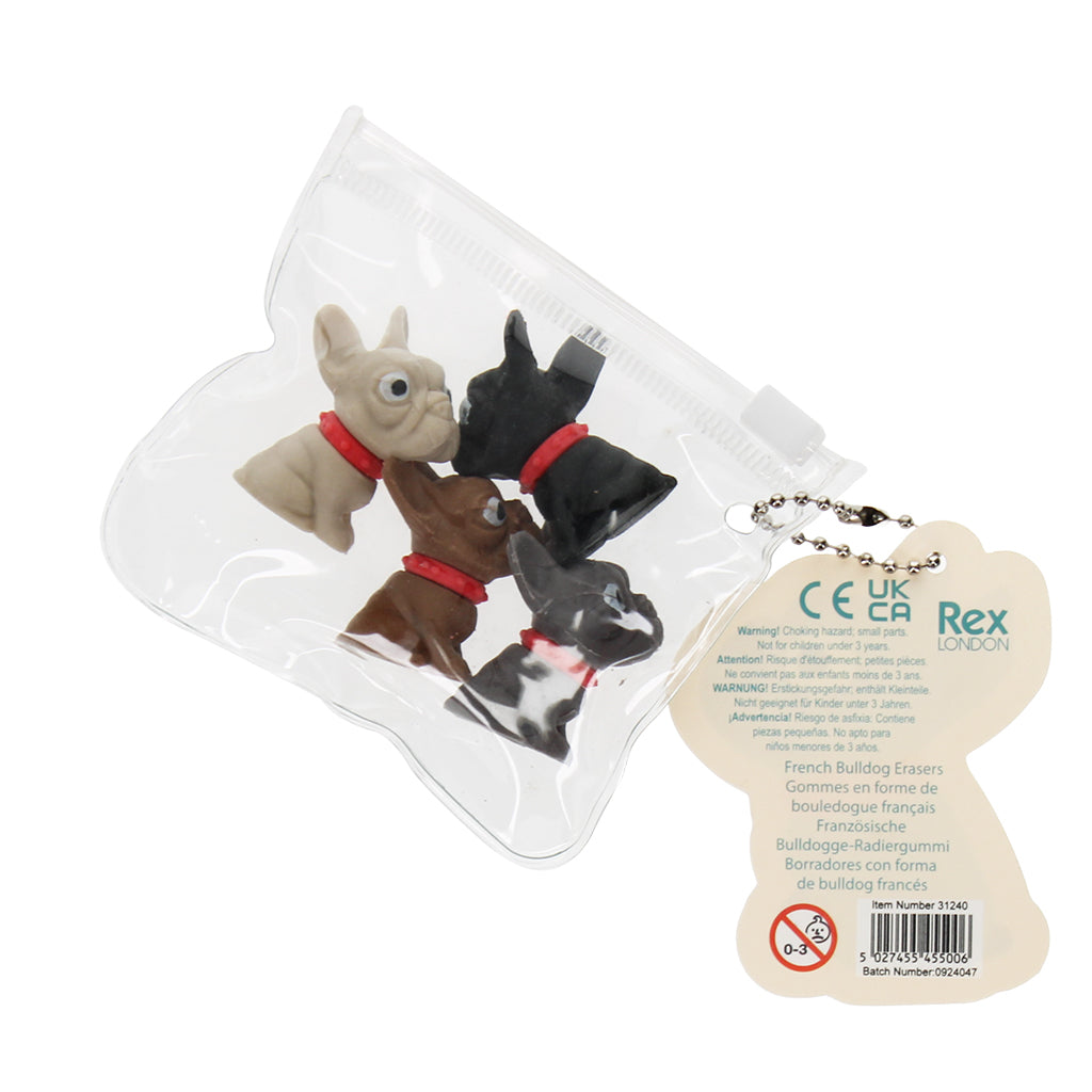Set of four small dog figurines in clear packaging with a label on a white background
