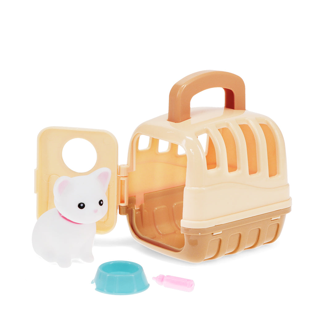 Toy pet carrier with a small white dog figure and accessories on a white background