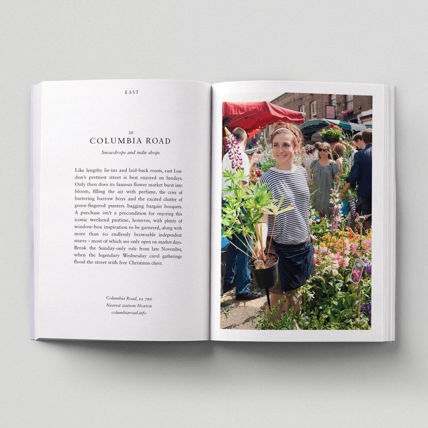 Open book with text and a photo of a woman at Columbia Road market.