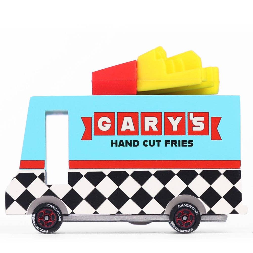 A Candylab wooden toy van styled as a French fry truck with a silicone topper shaped like fries, featuring a black and white checkered design on the sides and 'GARY'S HAND CUT Fries' text on the top.