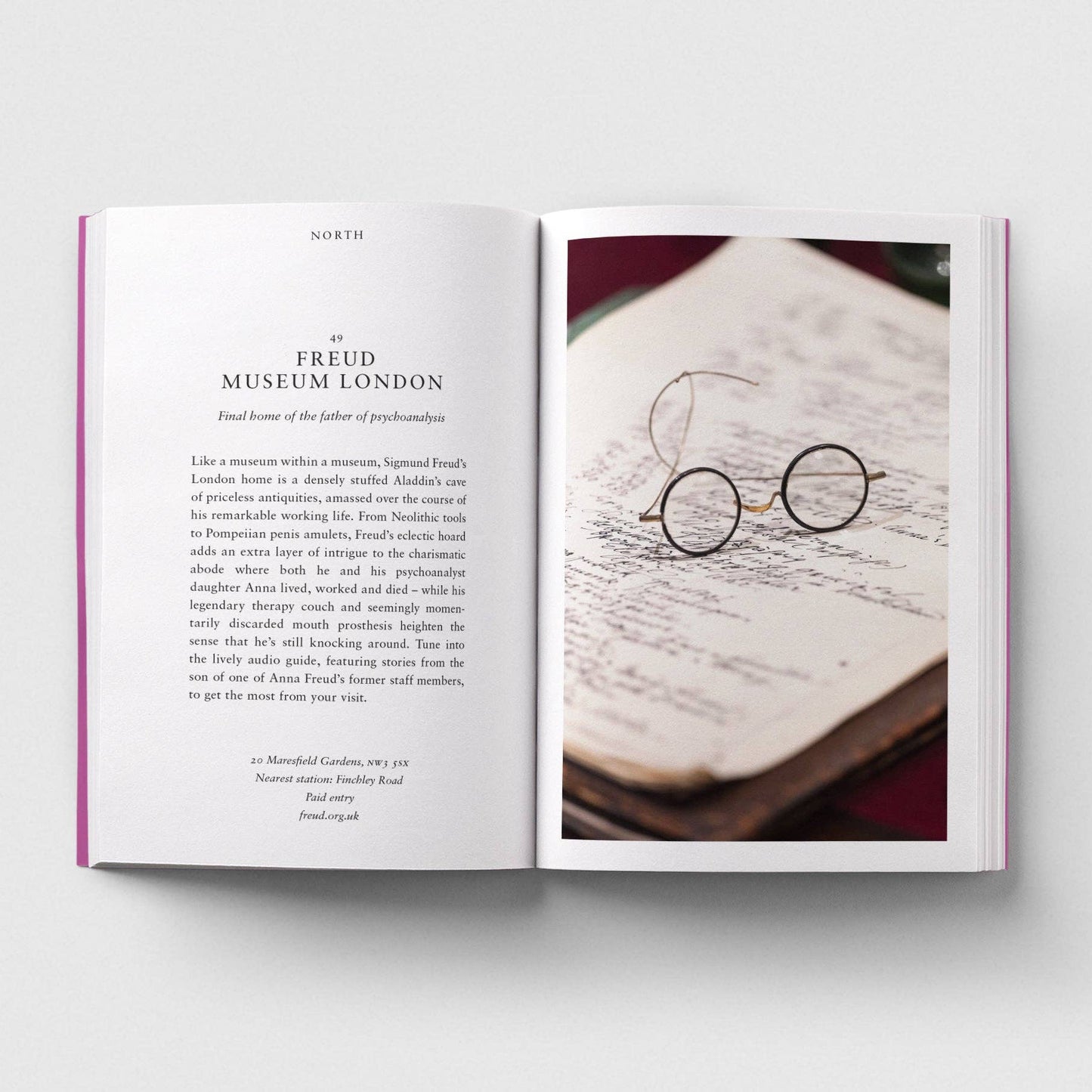 Open book with text and an image of round glasses on a white background