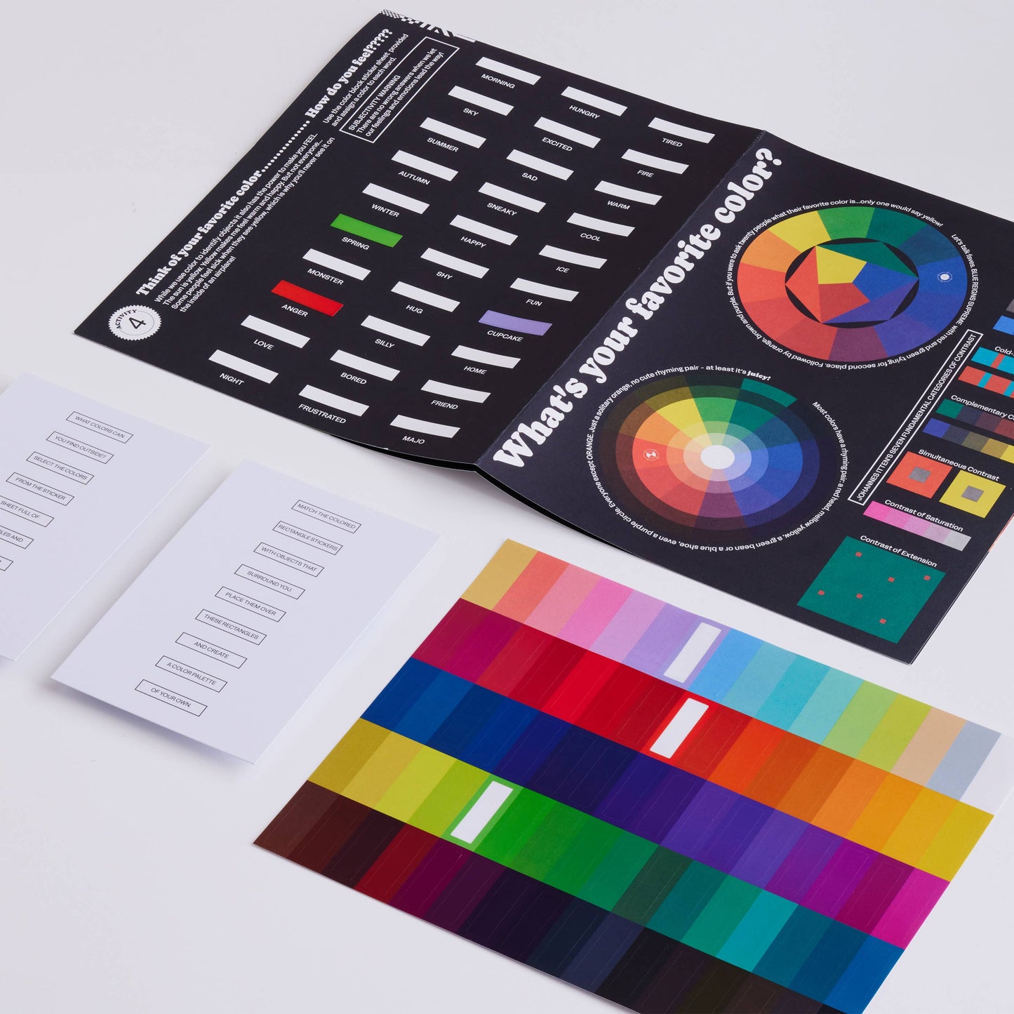 Colour swatch book with color wheel and sample cards on a white background