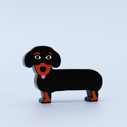 Black and red dog figurine on a light blue background