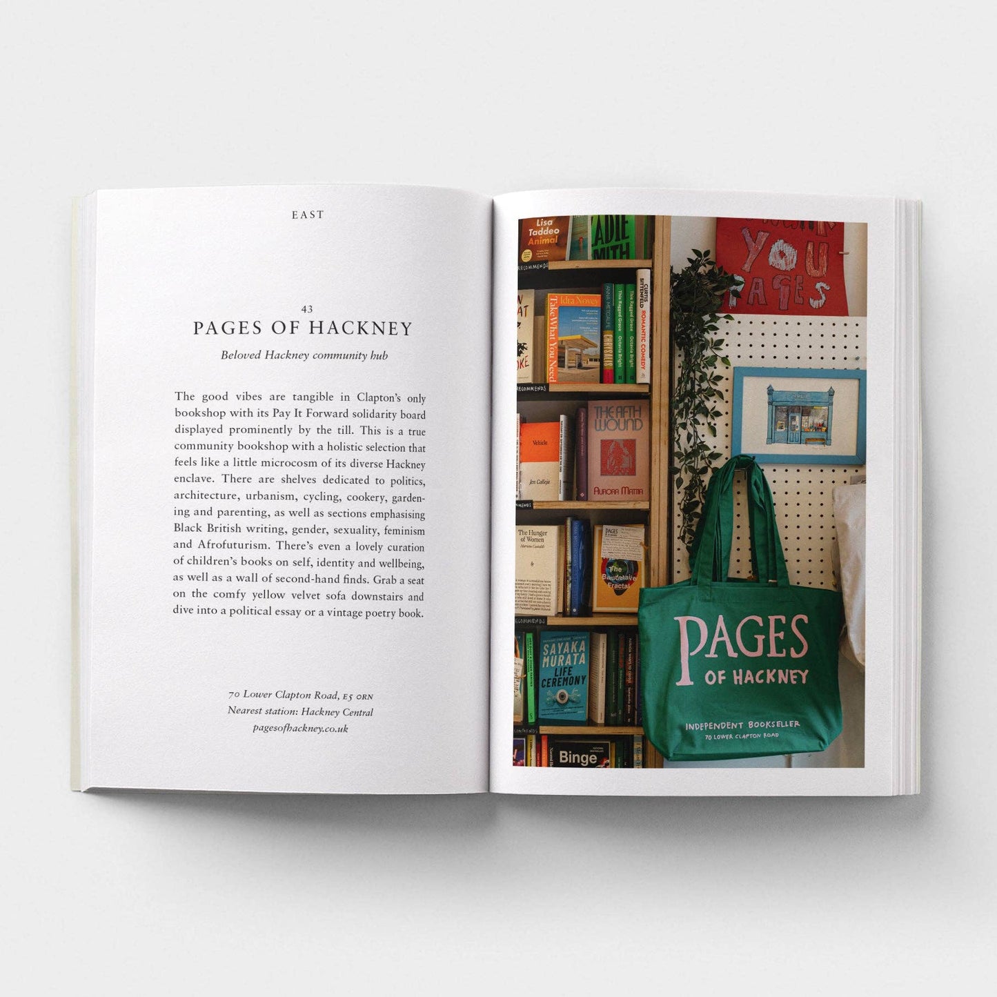 Open book with text and a picture of a bookshelf and green bag labeled 'Pages of Hackney'.