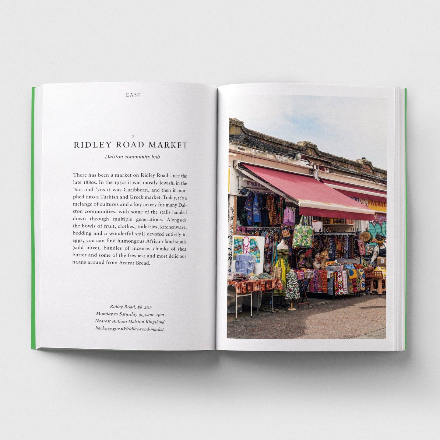 Open book showing text on one page and a photograph of Ridley Road Market on the other.