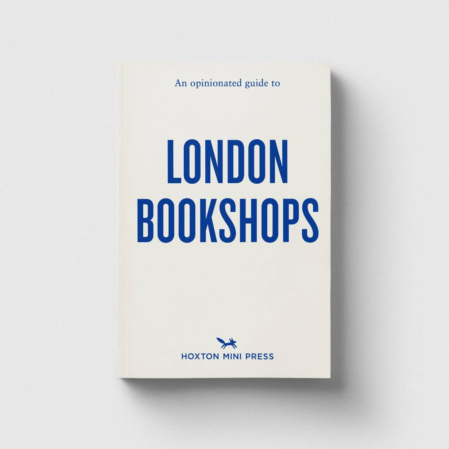 Book titled 'An Opinionated Guide to London Bookshops' by Hoxton Mini Press on a light gray background
