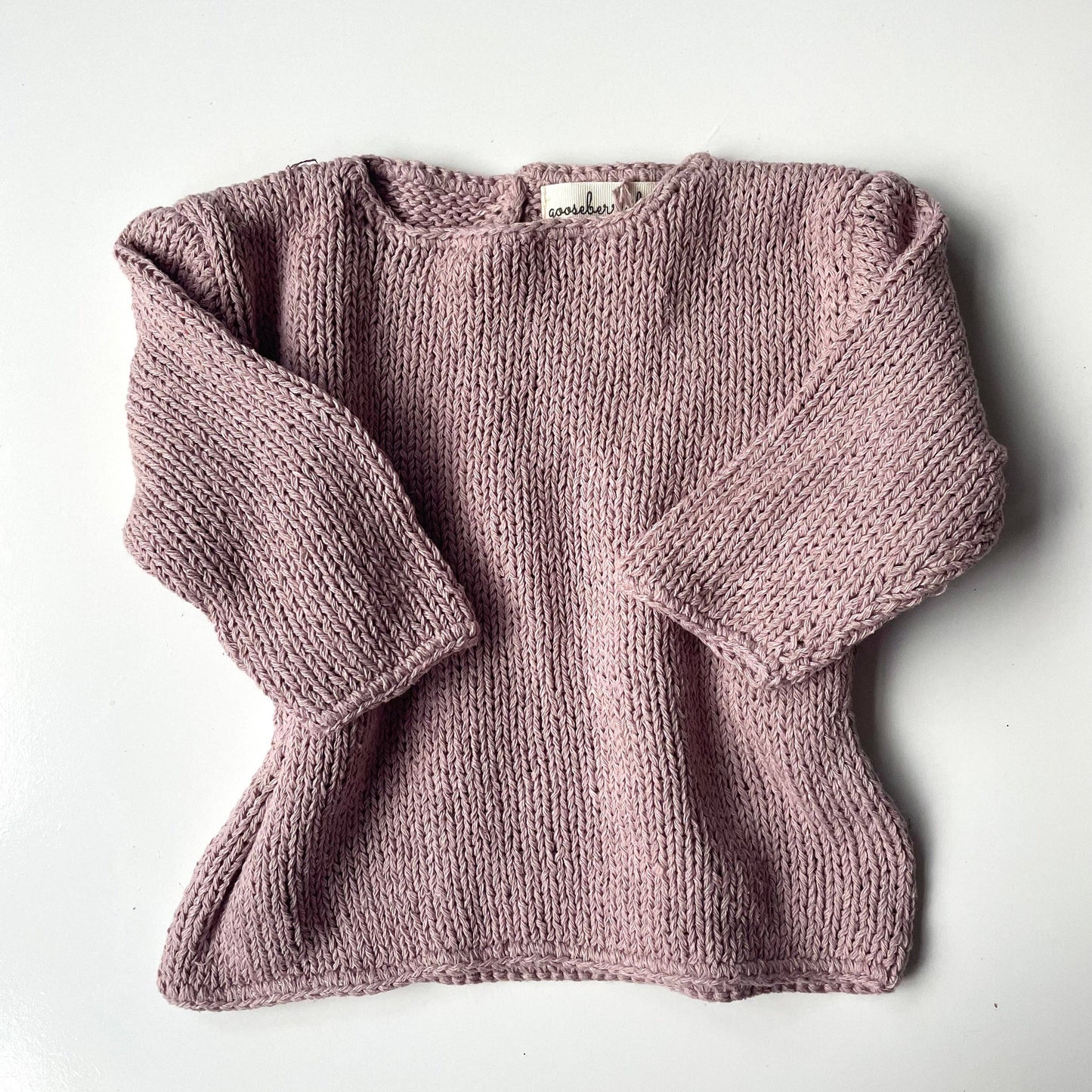 Knitted sweater on a white background
