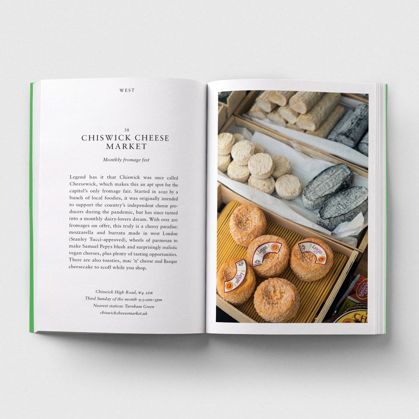Open book with text and image of Chiswick Cheese Market on a white background