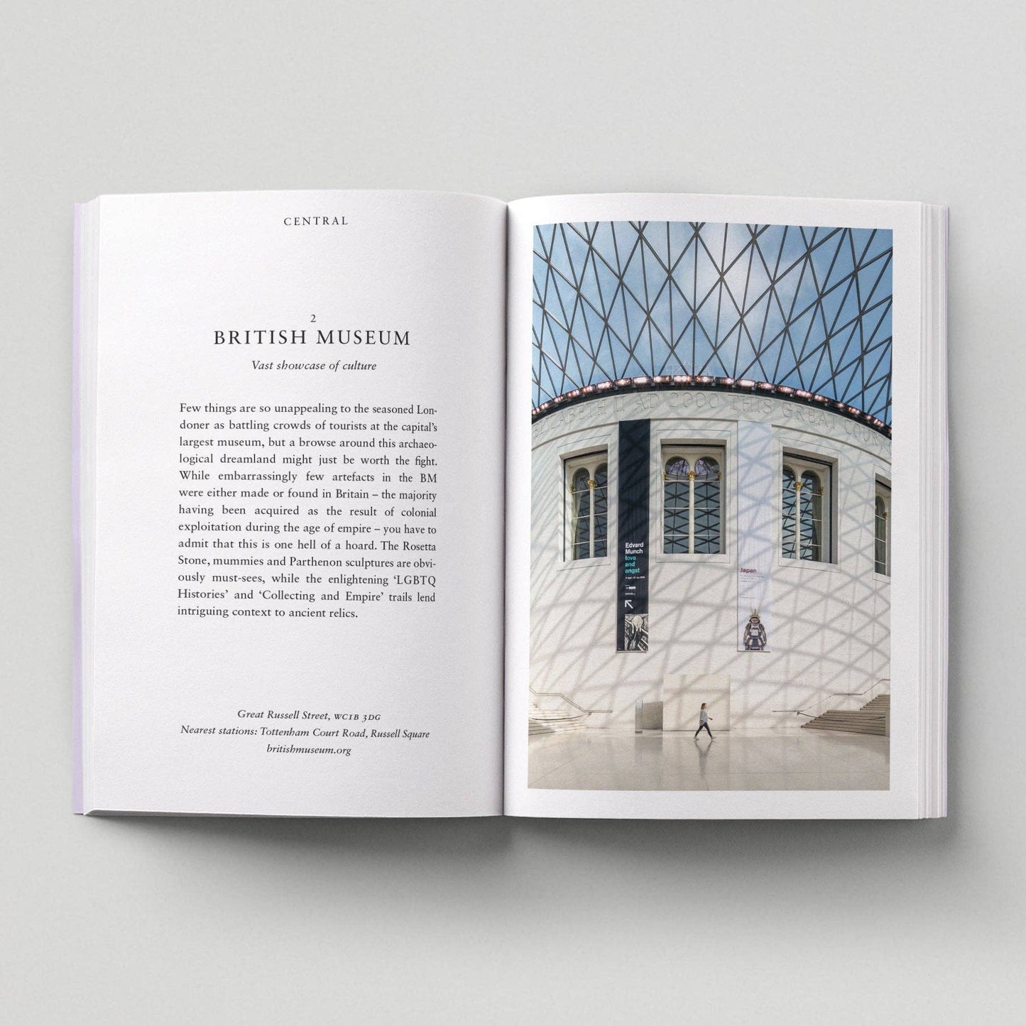 Open book showing a page with text and an image of the British Museum's architecture.