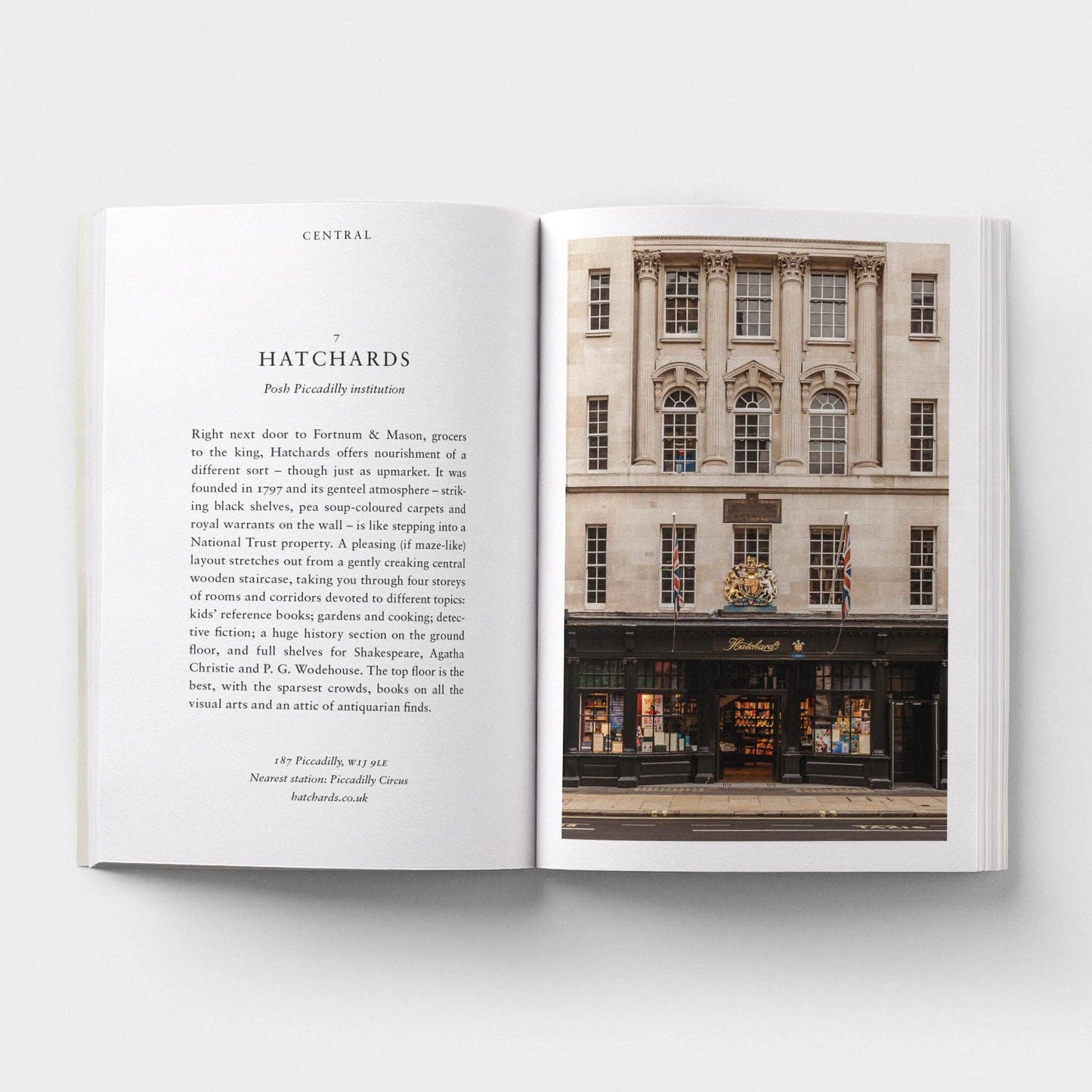 Open book showing text and an image of a building facade