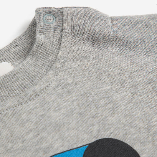 Gray sweater with a blue and black design on a white background