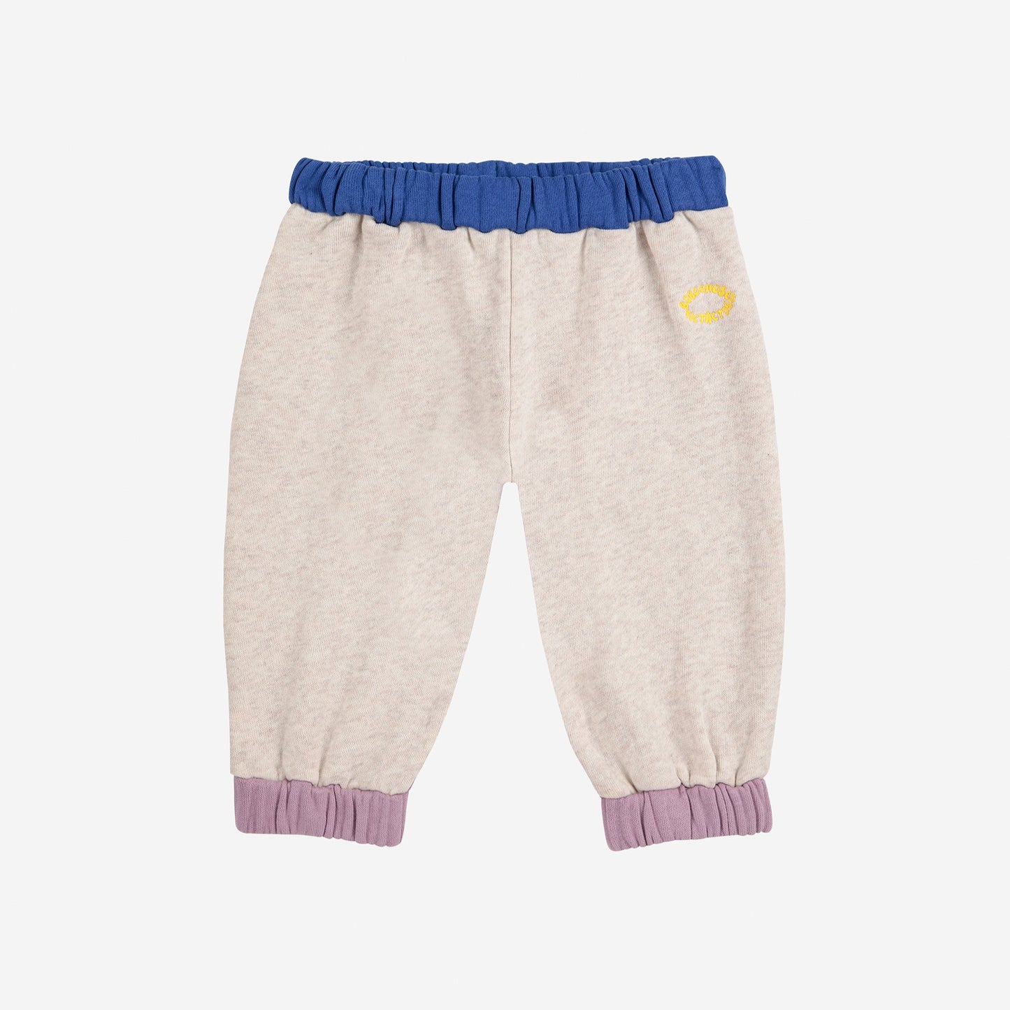 Beige pants with blue and purple accents on a light gray background
