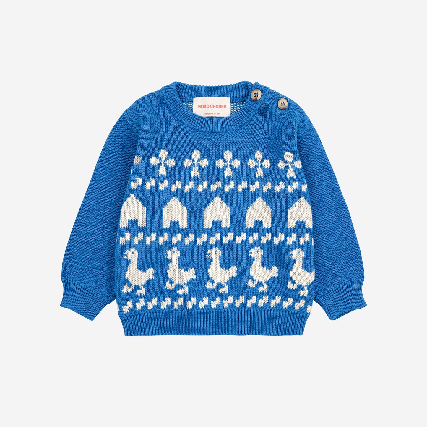 Blue sweater with white pattern on a light gray background