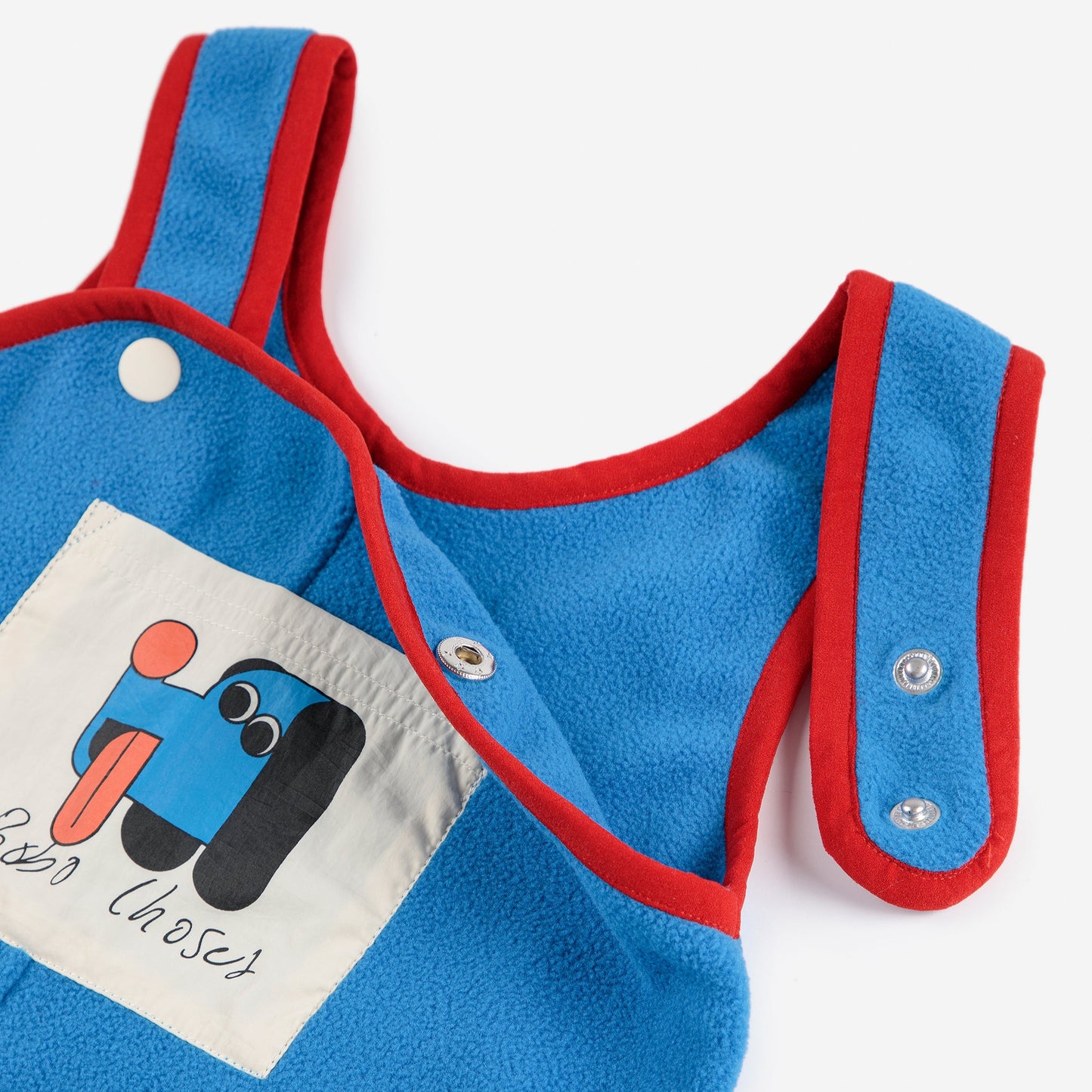 Blue baby romper with red trim and a cartoon design on a white background
