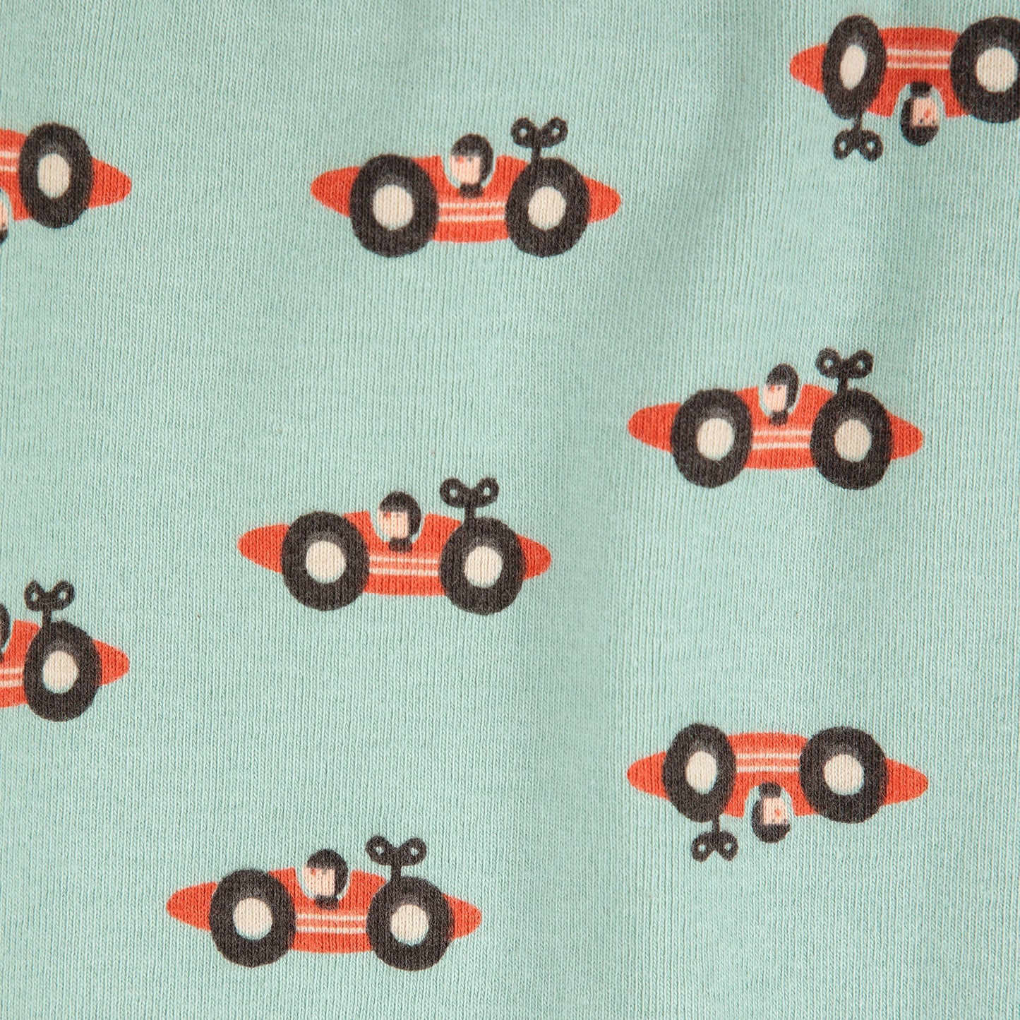 Pattern of red race cars with black wheels on a light blue background