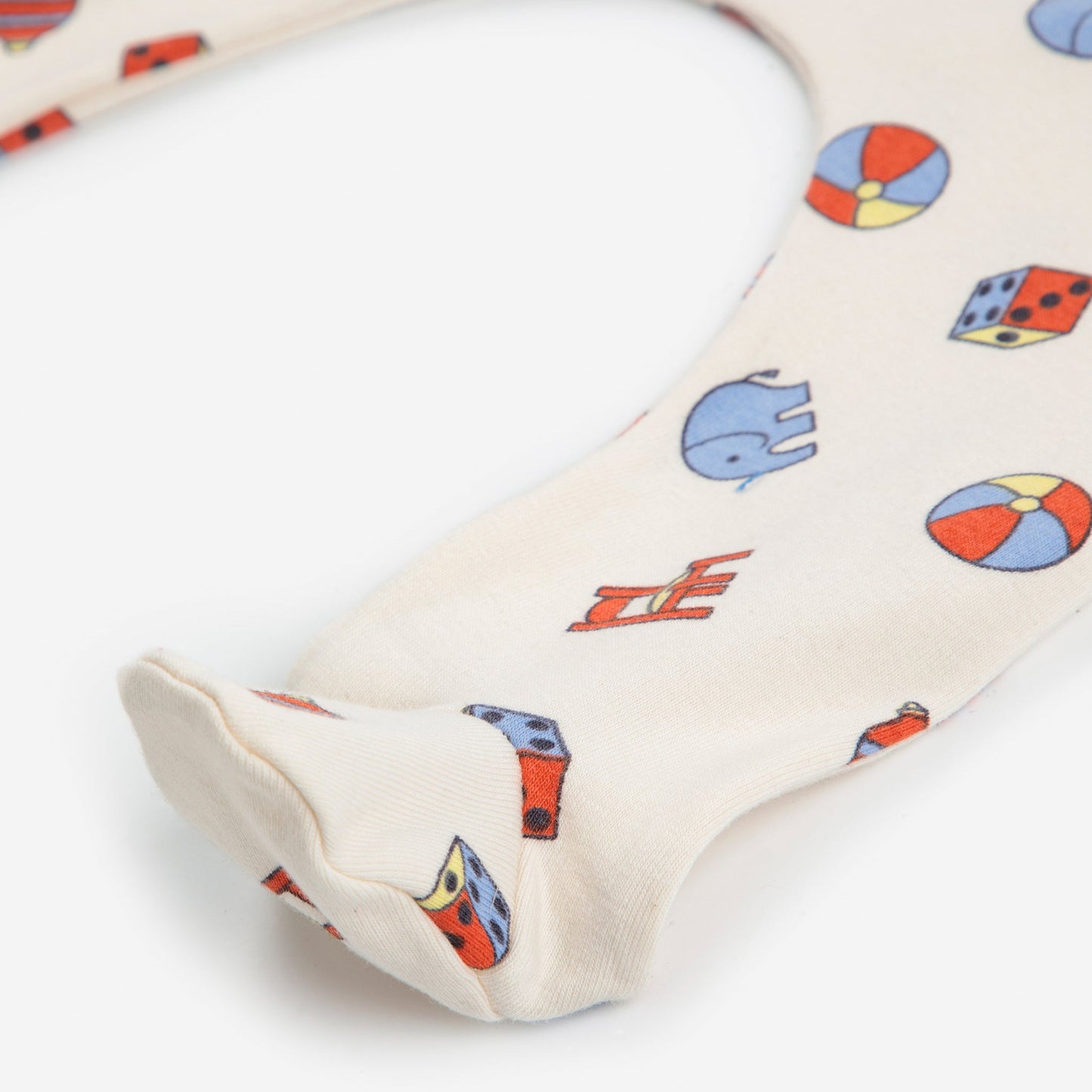 Baby boppy pillow with colourful geometric pattern on a white background