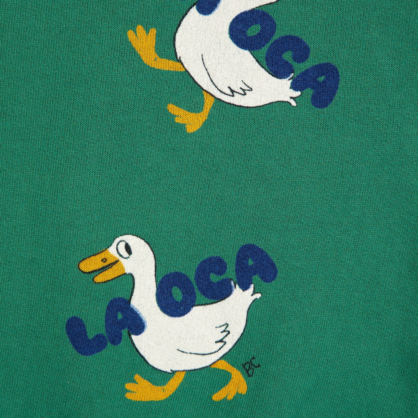 Green fabric with 'La Oca' duck illustrations