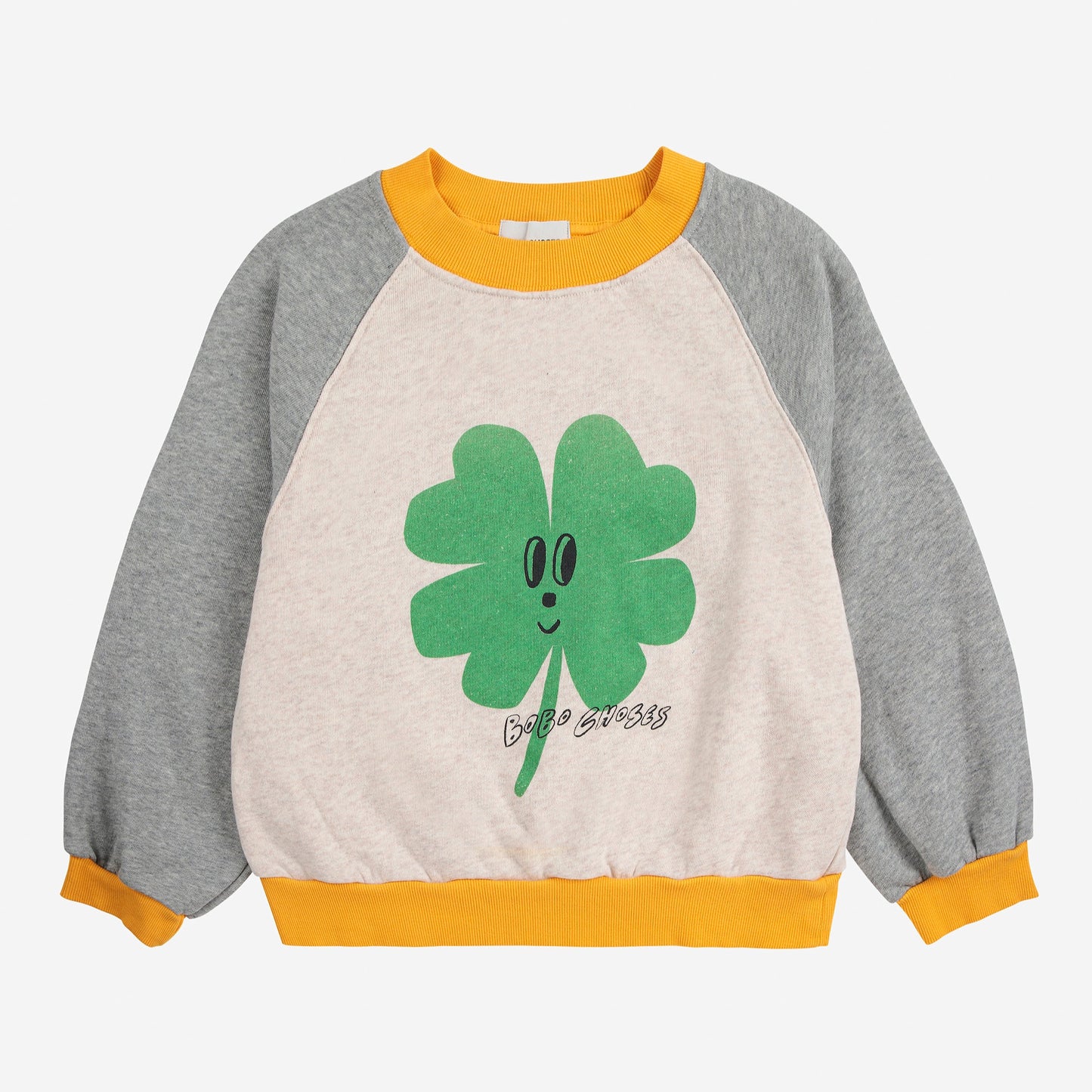 Children's sweatshirt with a smiling four-leaf clover design on a white background
