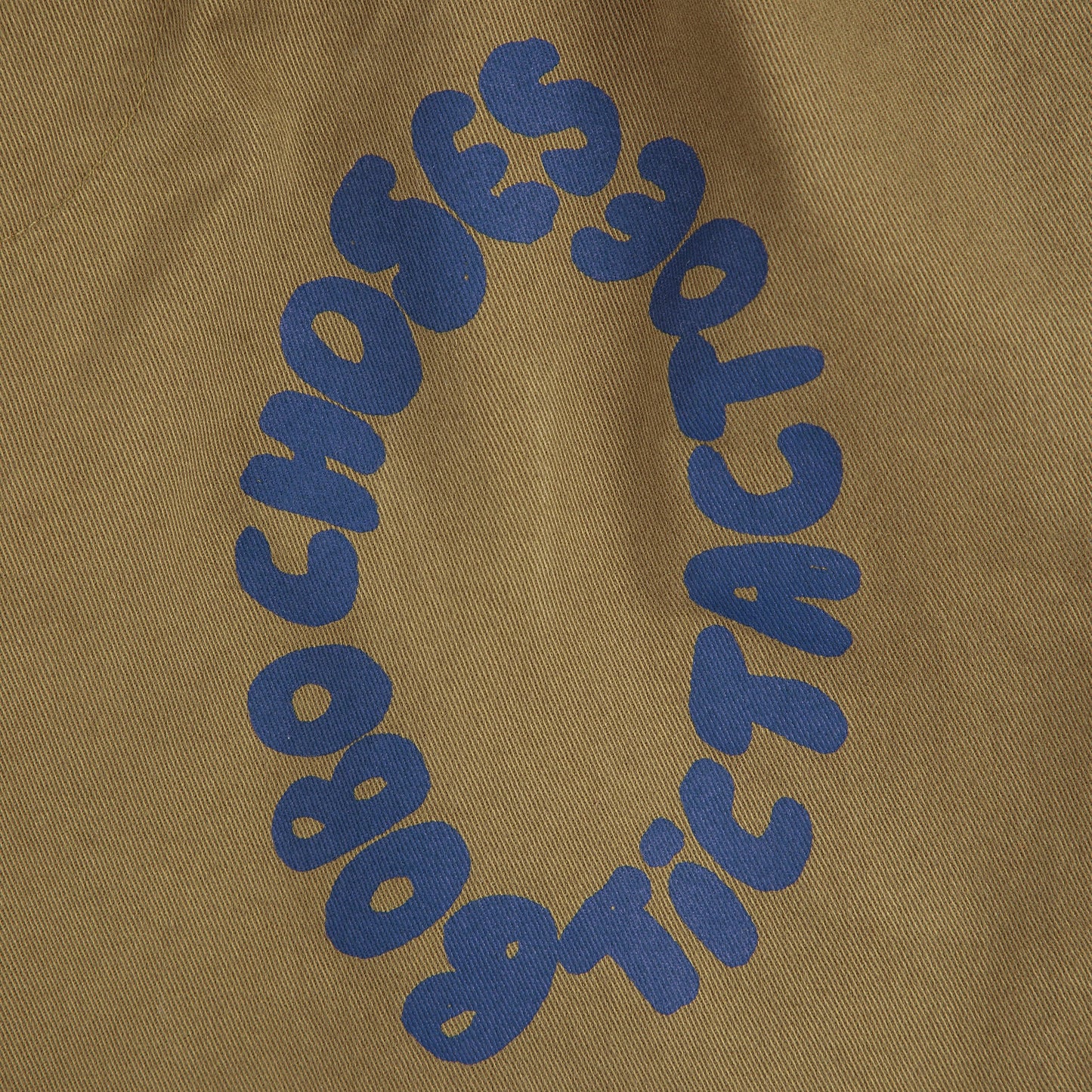 Brown fabric with blue 'Obochoes' text in a circular pattern