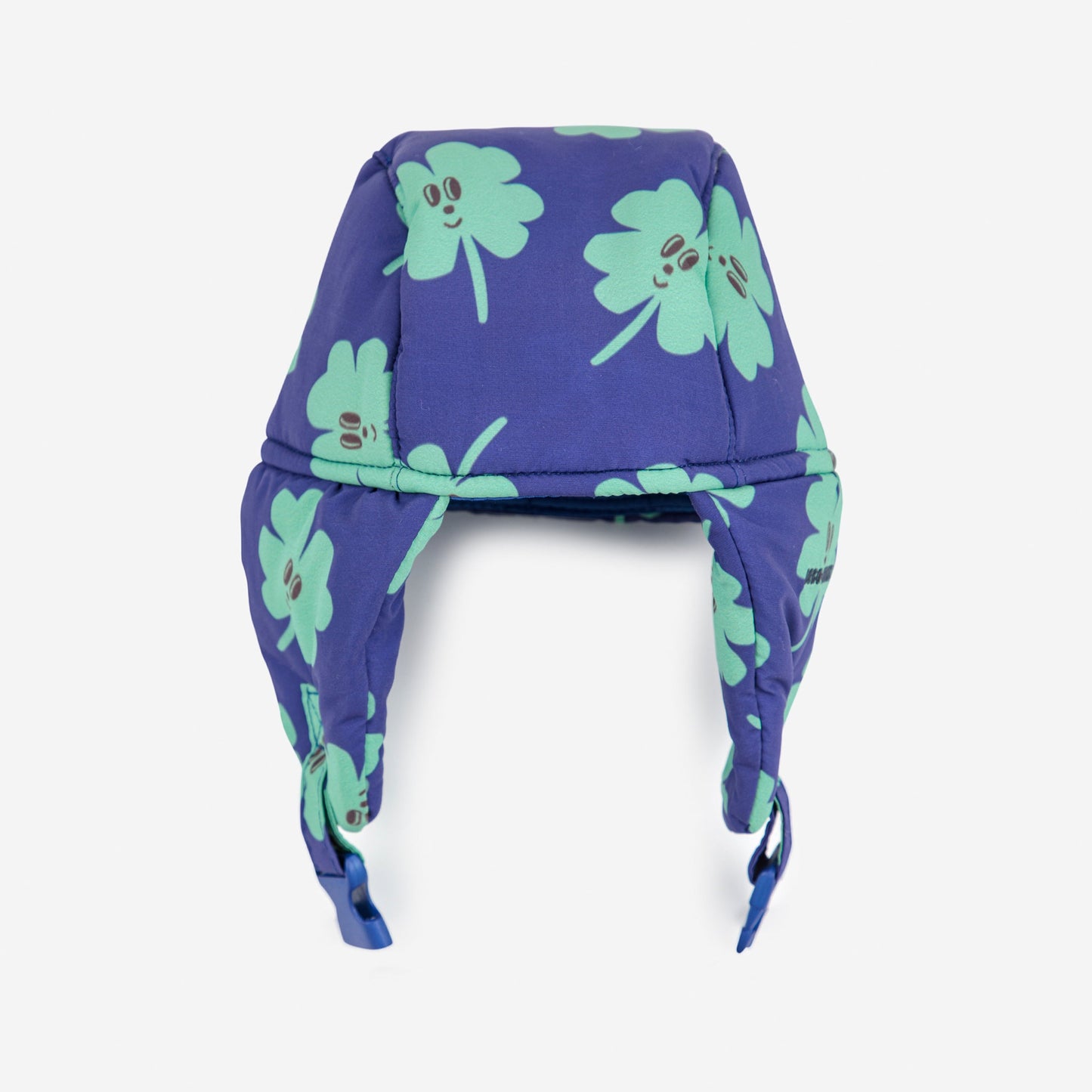 Purple headband with green clover patterns on a white background