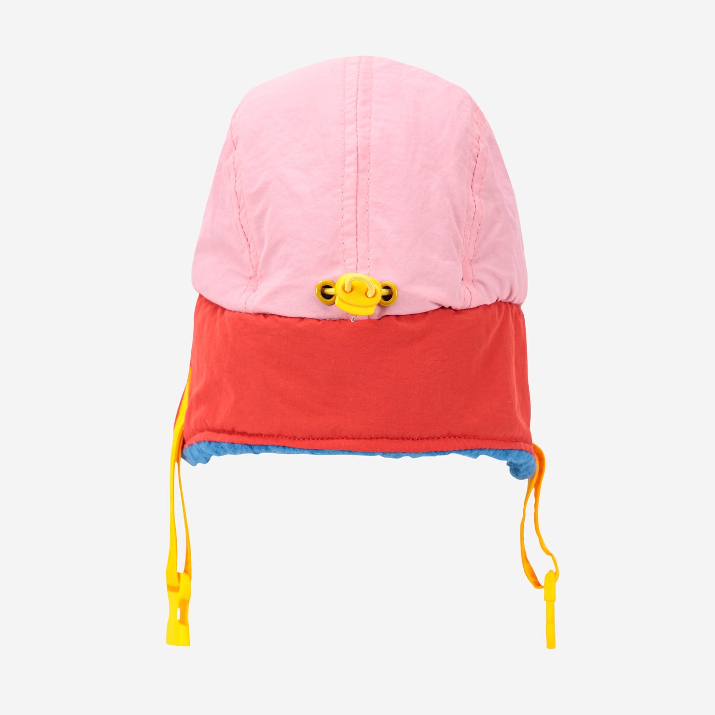 Colorful children's hat with pink top, red middle, and blue bottom on a white background
