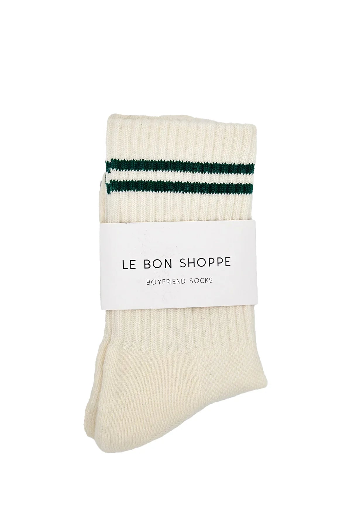 Pair of cream socks with green stripes and a white label on a white background