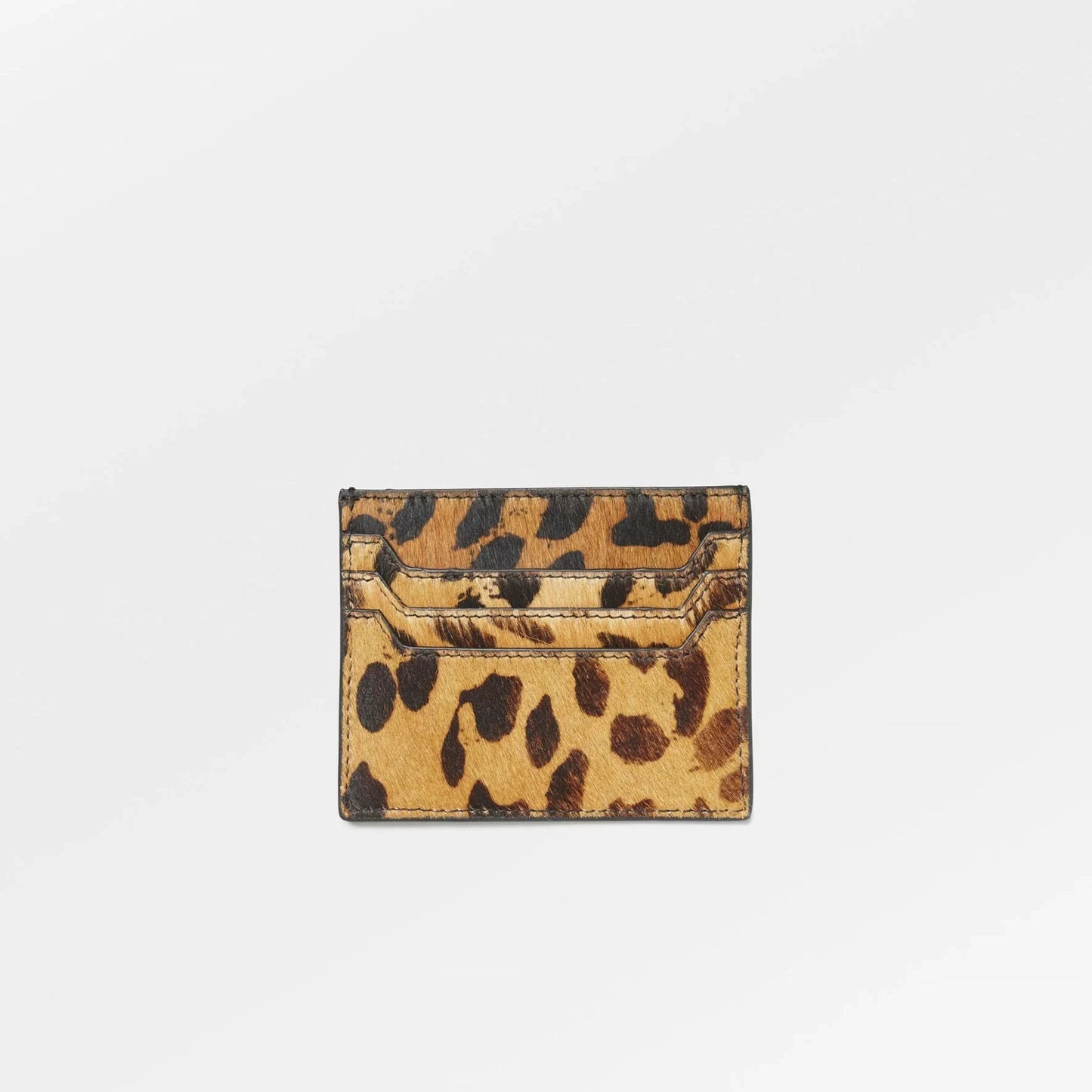 Becksöndergaard leopard-print leather card holder featuring a compact design with multiple card slots and a bold spotted pattern on textured leather