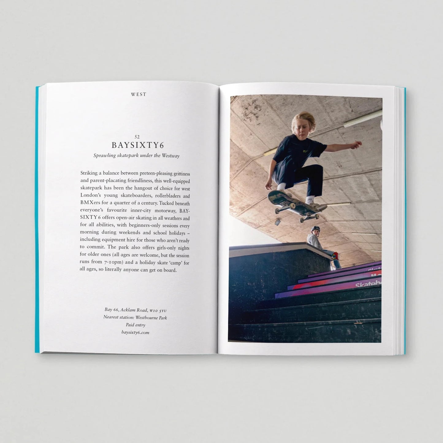 Open book with text and a photo of a person skateboarding on a gray background