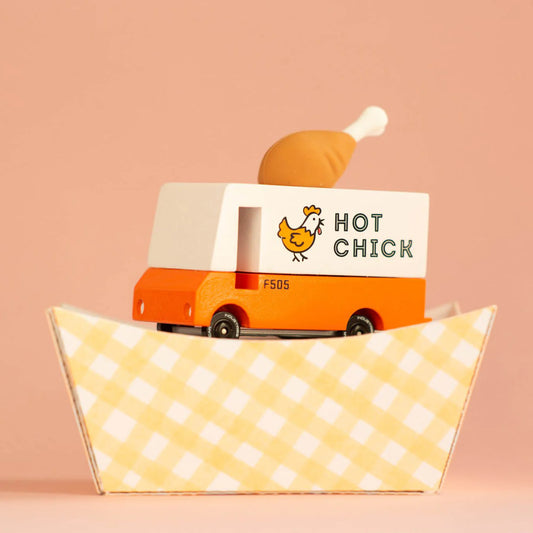 Toy truck with 'Hot Chick' branding on a pink background
