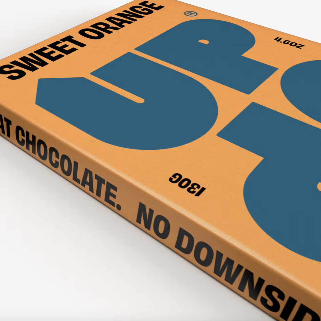 Close up of UP UP Sweet Orange Milk Chocolate bar on a white background