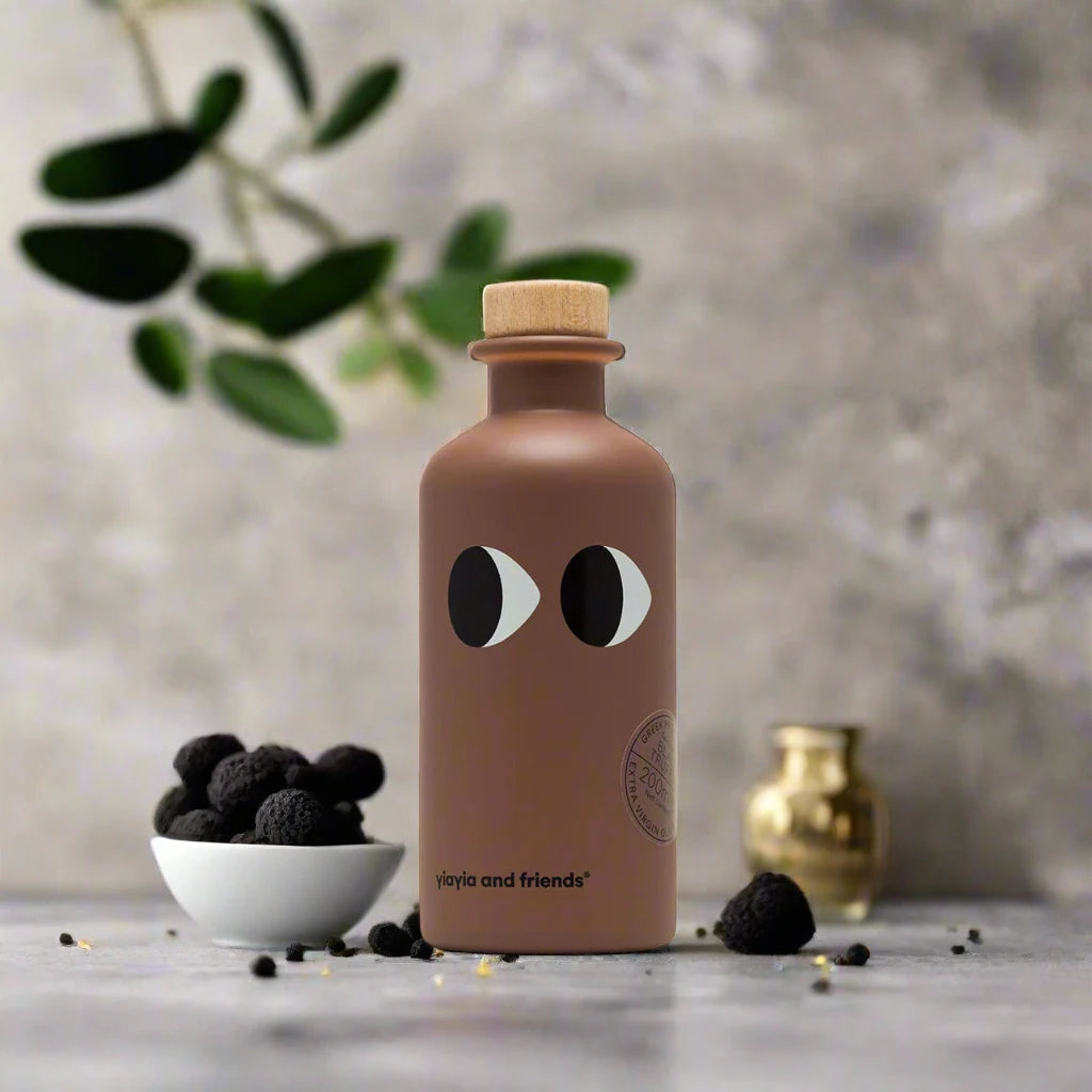 Bottle with face design on a surface with decorative elements