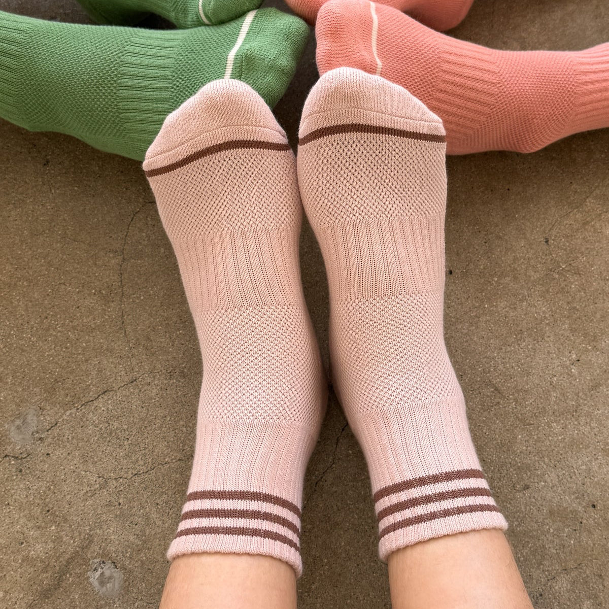 Colorful socks on a concrete floor