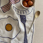 Amuse La Bouche Eggs & Bacon Tea Towel
