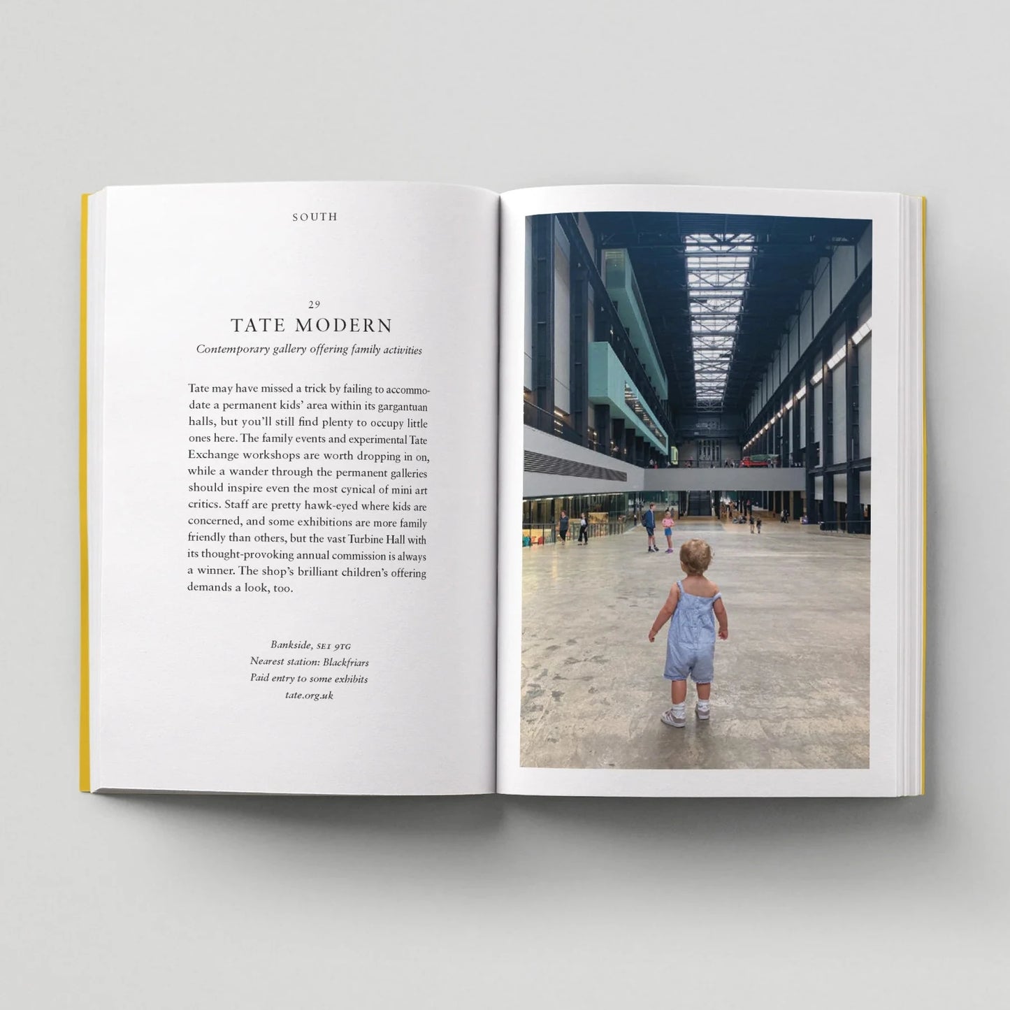 Open book showing a photo of a child walking in a modern building with text on the left page.
