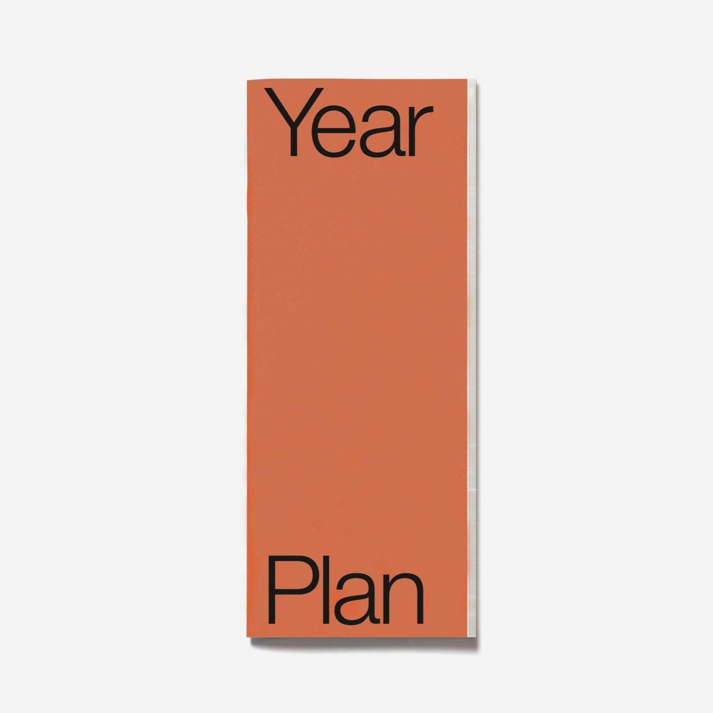 Orange planner with 'Year Plan' text on a white background