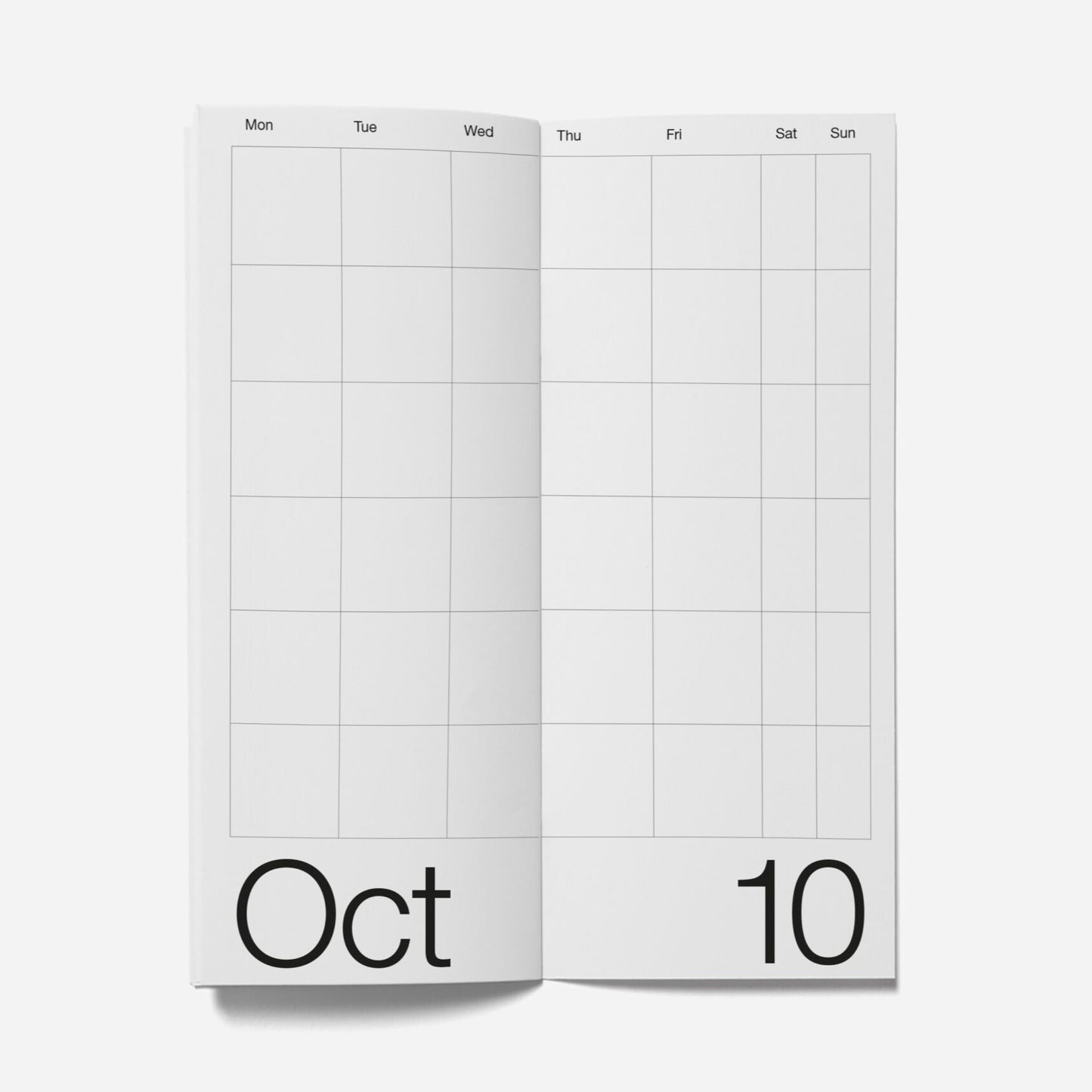 Open planner showing a month layout with 'Oct' and '10' on a white background