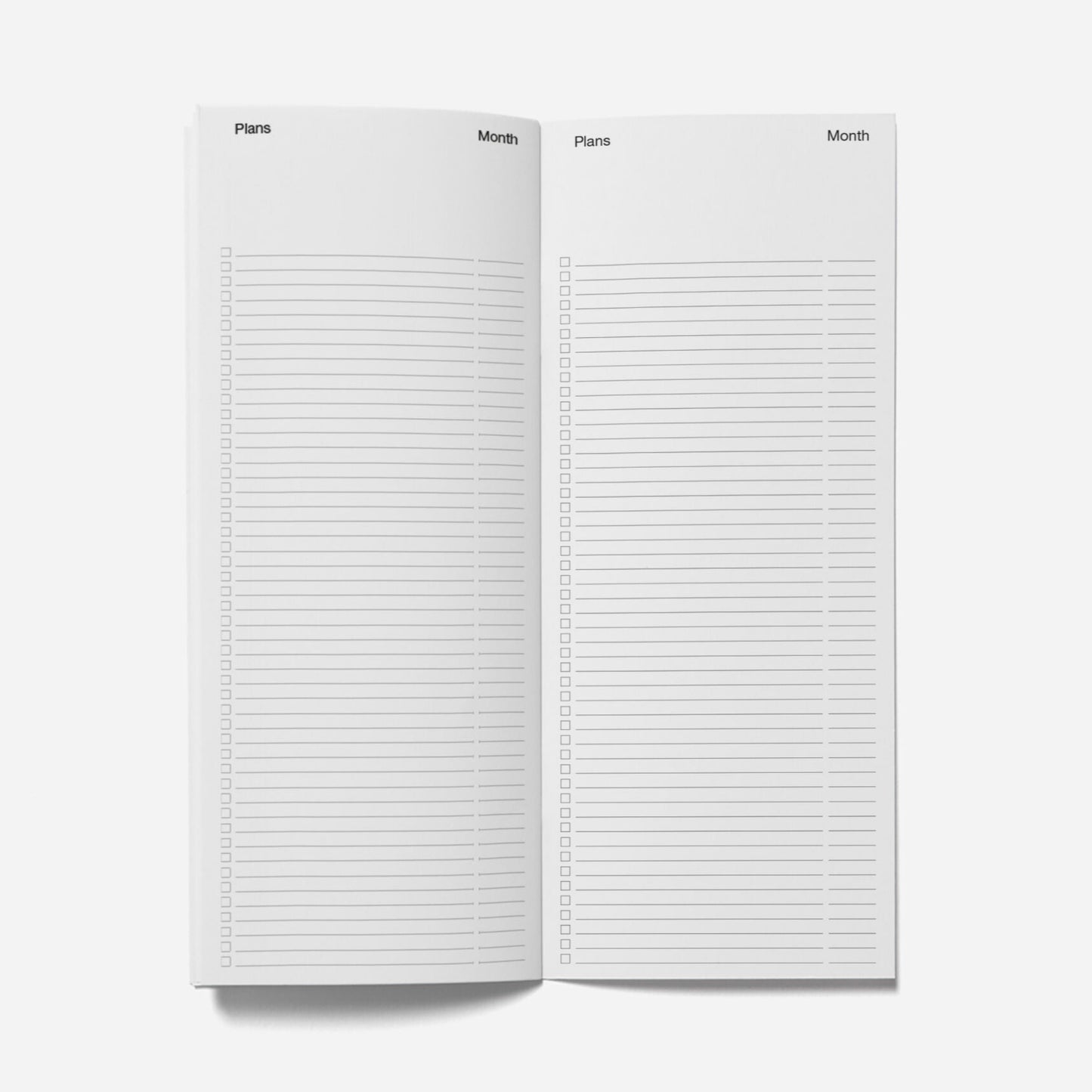 Two open notebooks with lined pages on a white background