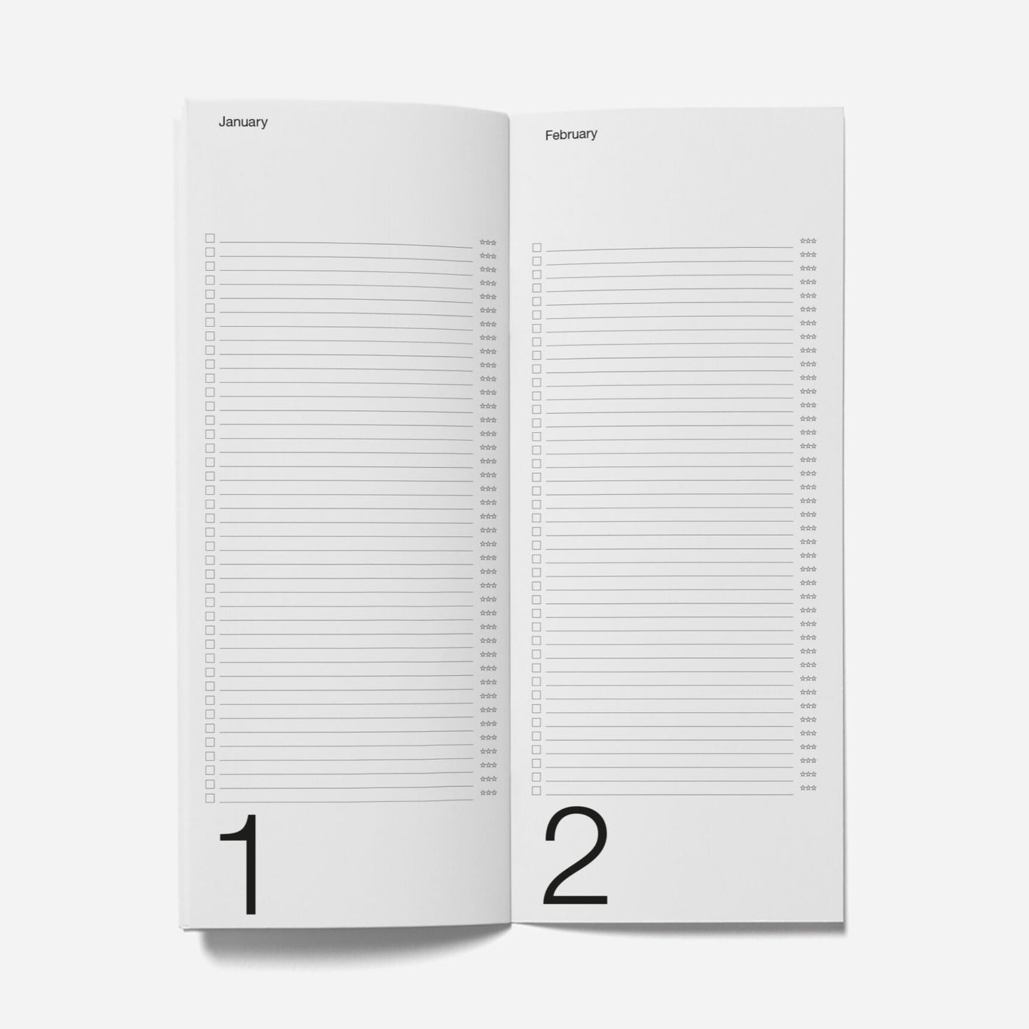 Two white pages with grid patterns and numbers on a light gray background
